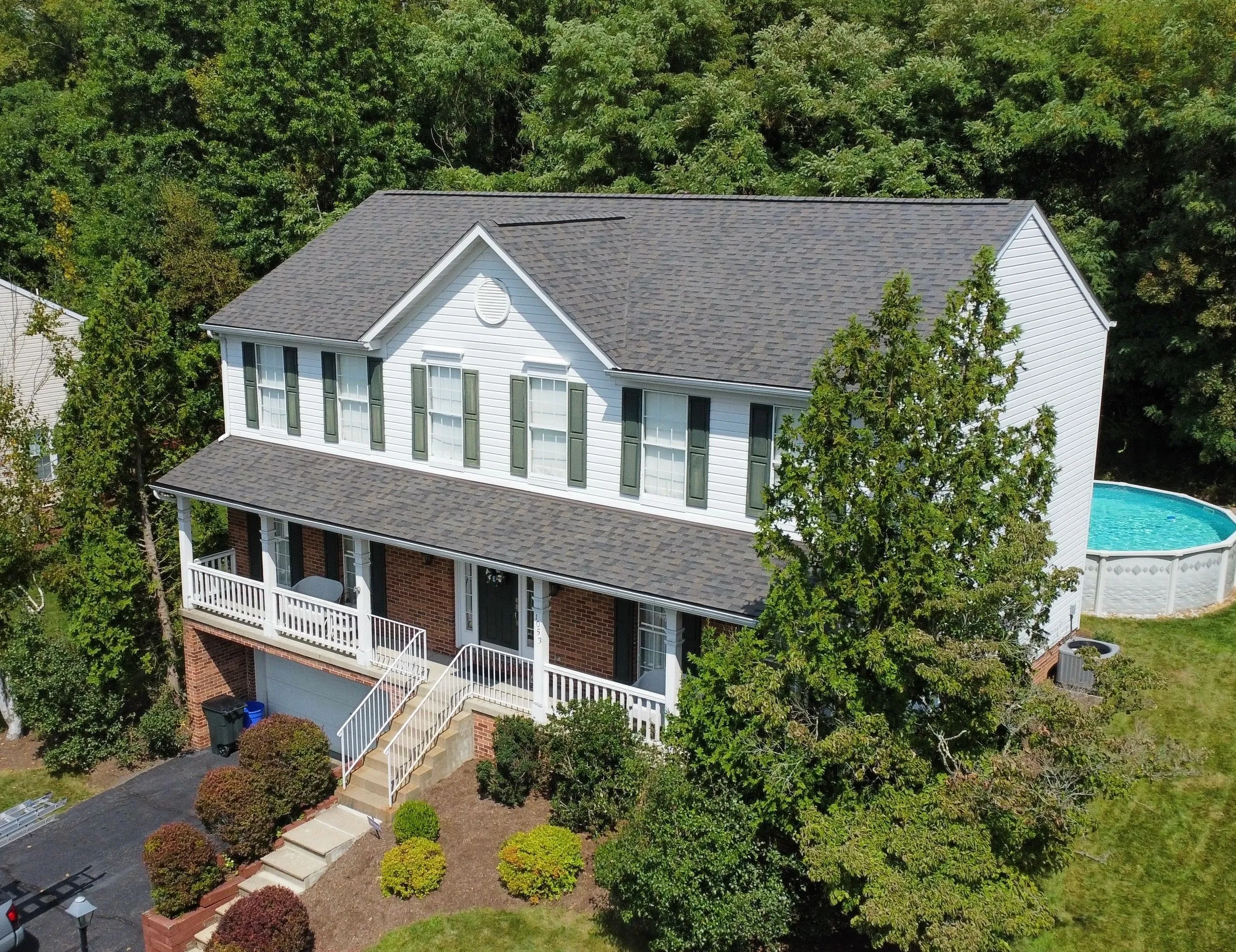 Aerial view of a completed grey architectural shingle roof on a Pittsburgh home