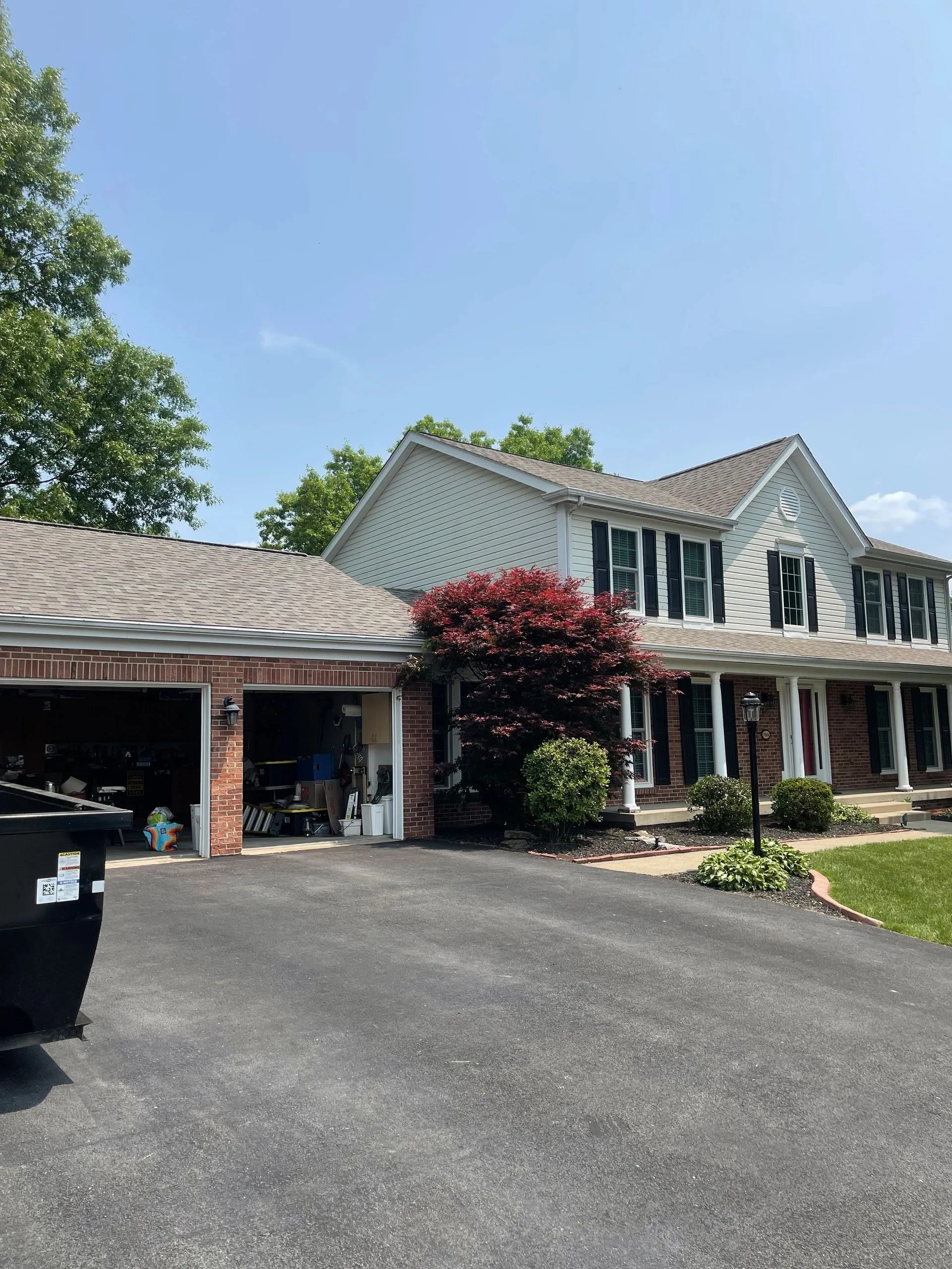 A completed roof on a large suburban Pittsburgh home