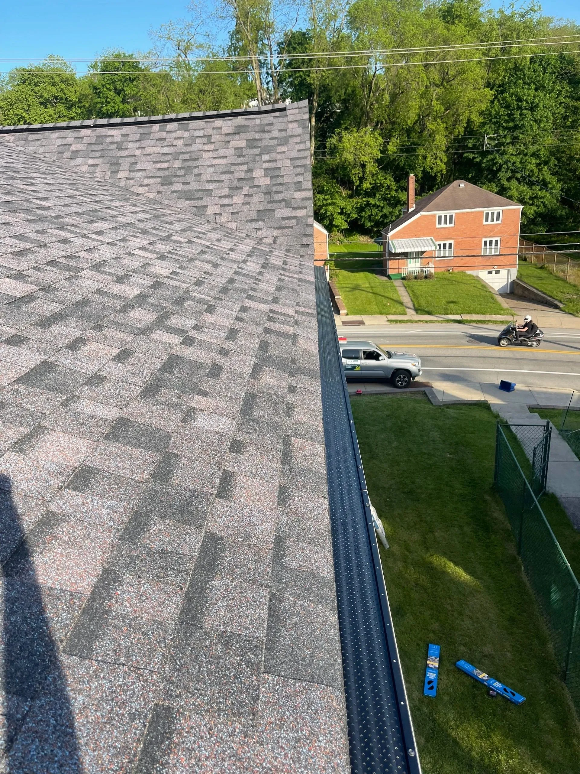 A new shingle roof showing a finished valley running into the gutter line